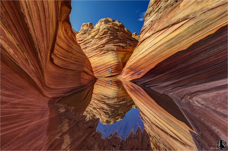 The Wave is a sandstone rock formation located in the United States of America near the Arizona-Utah border, on the slopes of the Coyote Buttes, in the Paria Canyon-Vermilion Cliffs Wilderness, on the Colorado Plateau. It is famous among hikers and photographers for its colorful, undulating forms, and the rugged, trackless hike required to reach it.